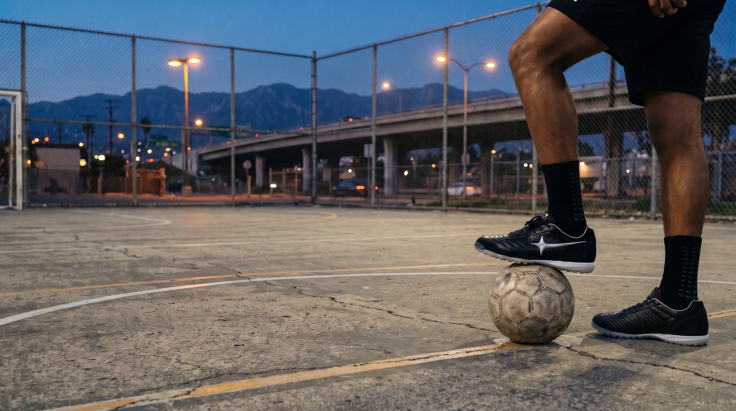 BOT-TF in carbon on a public futsal court in Los Angeles at blue hour